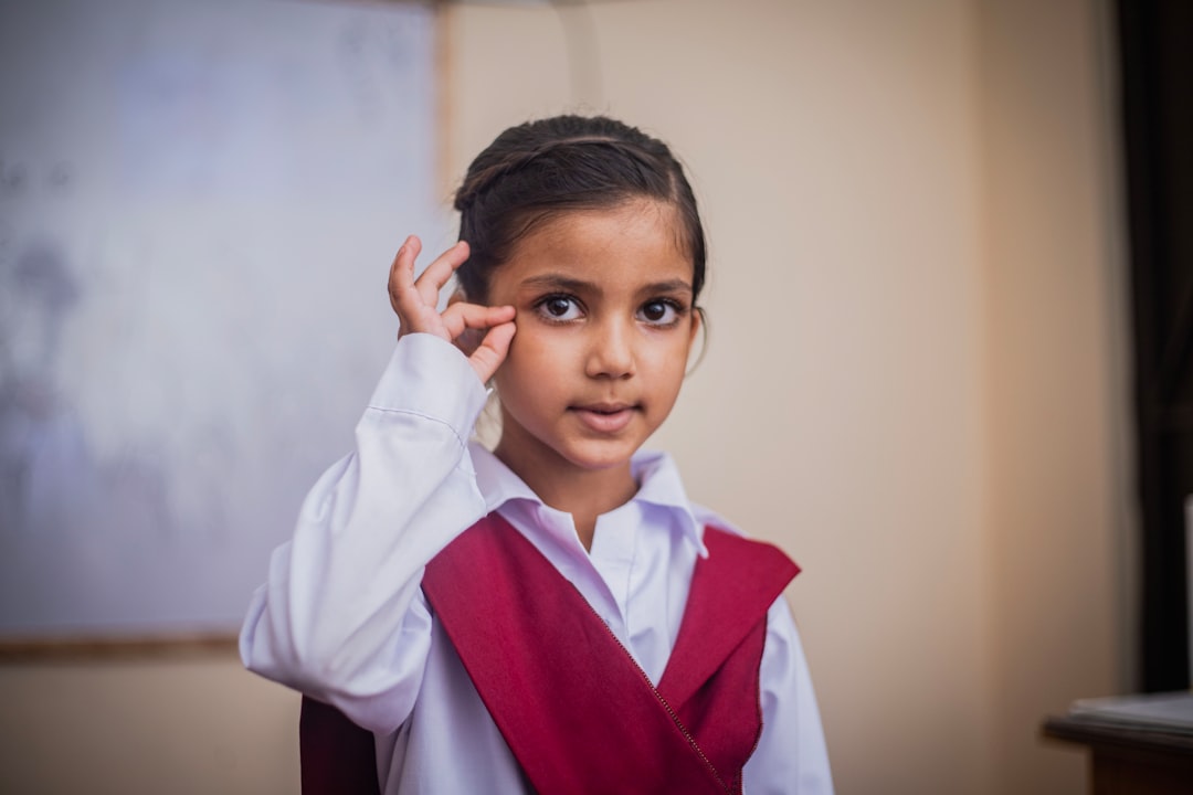 about-02 A small cute students practice for speaking and hearing in sign language